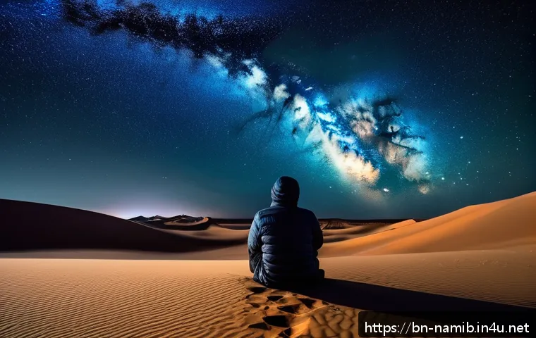 나미비아 별 관측 명소 - A serene nighttime desert scene in Namibia featuring a vast star-filled sky with the Milky Way galax...